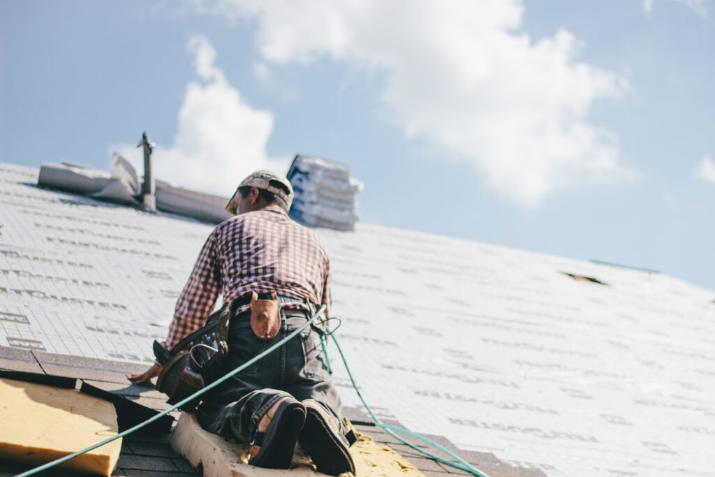 Roofer Adding Shingles To The Roof Of A House 2022 11 16 18 35 52 Utc